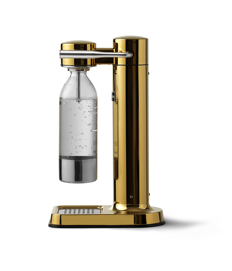 Aarke Carbonator 3 in Gold. Side view with PET bottle attached.